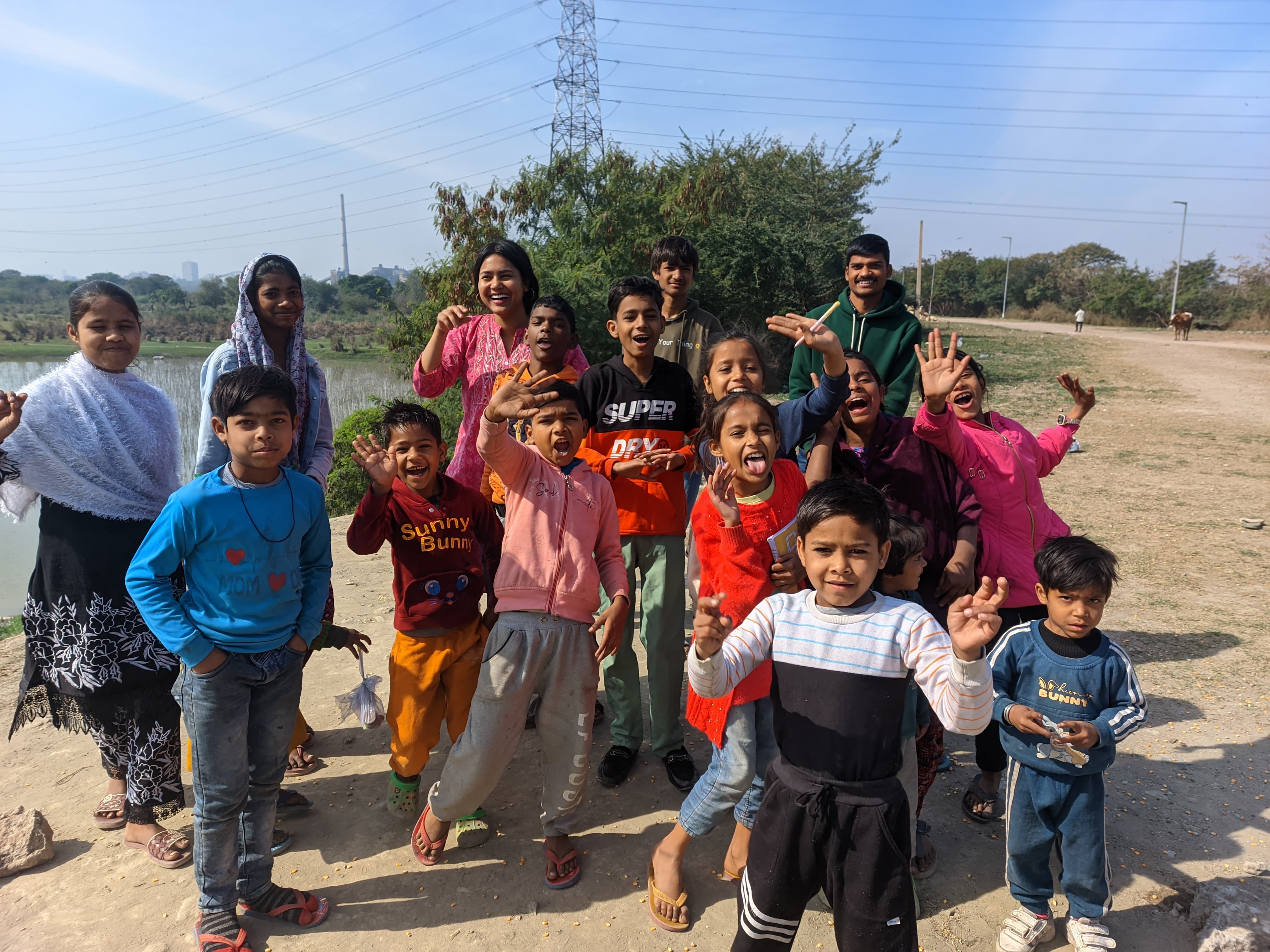 Children studying together outdoors during a SKYPA learning activity
